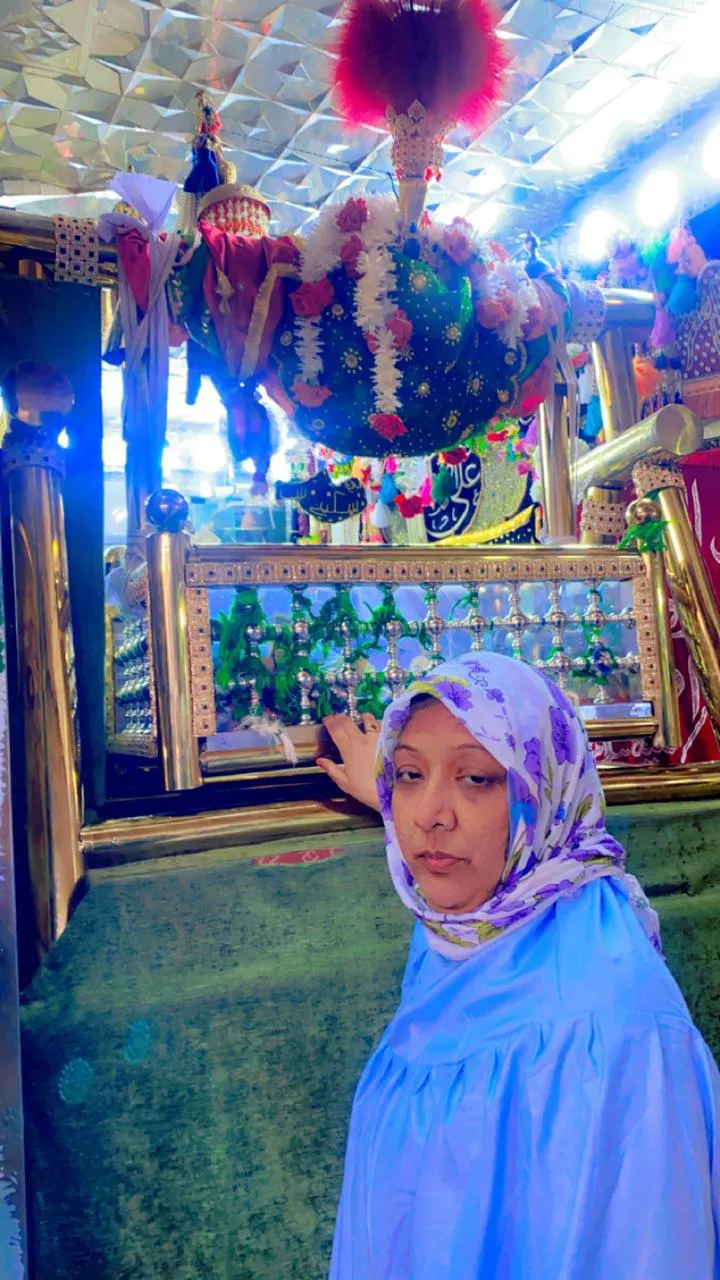 Woman standing inside shrine chamber
