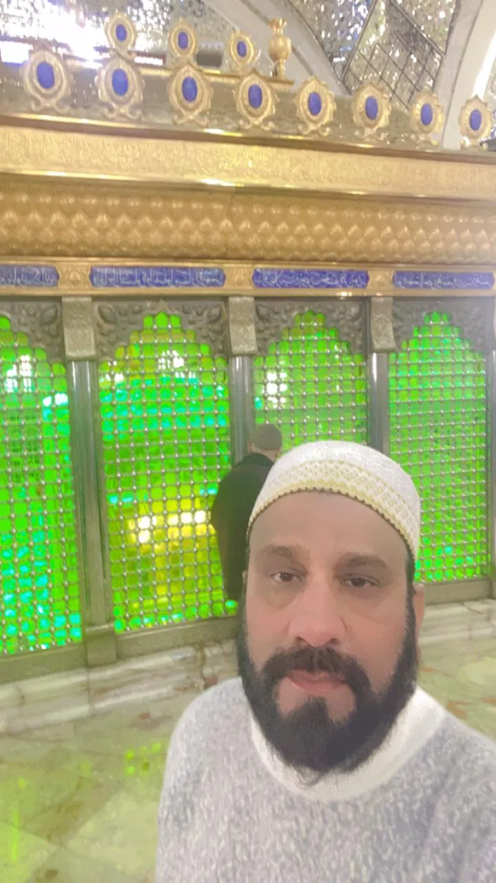 Portrait near the golden lattice of the shrine