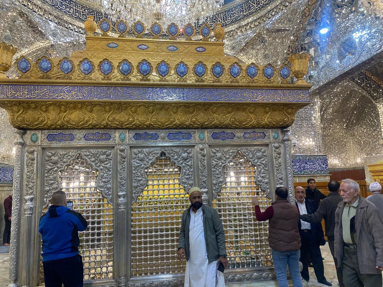 People gathered around golden zarih