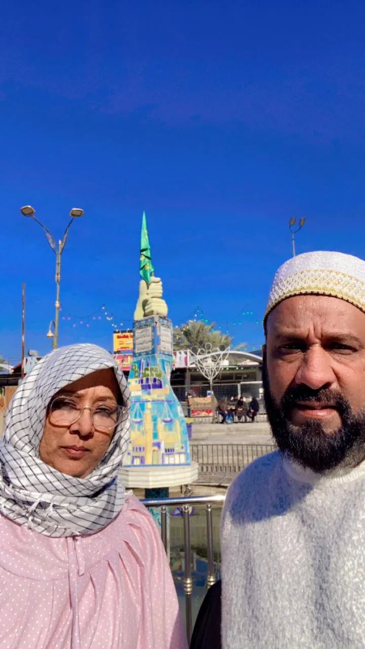 Couple posing outside shrine complex