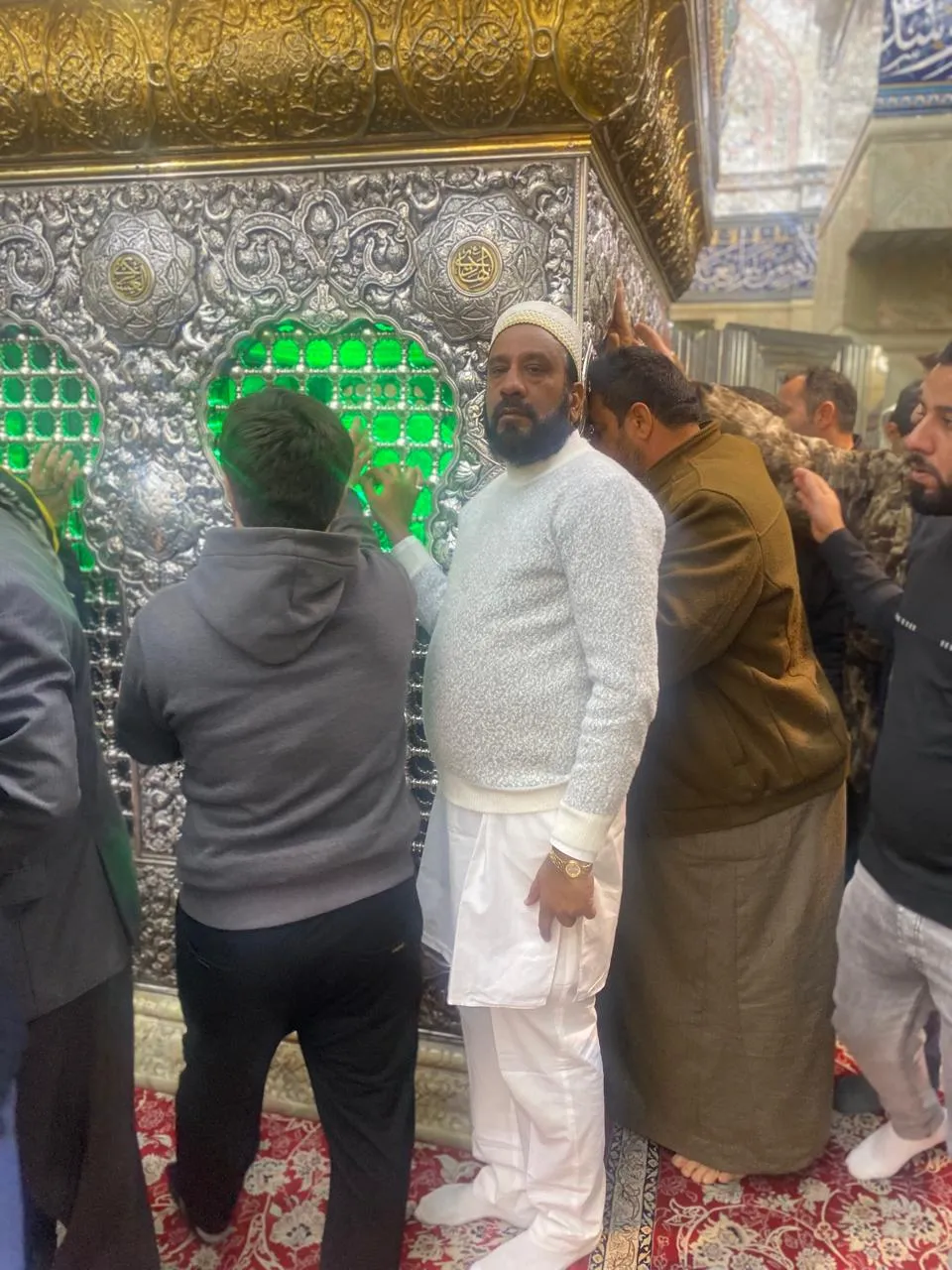 Visitors praying inside shrine hall