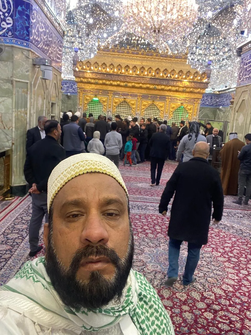 Man standing inside shrine interior